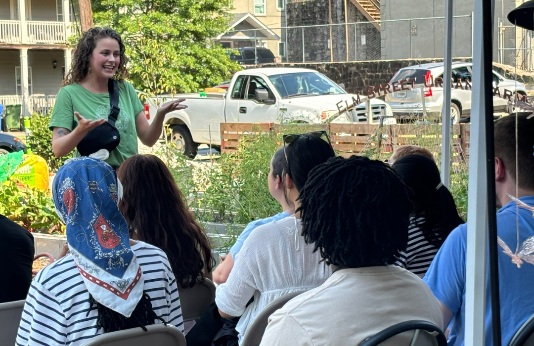 Staff member talking to student group